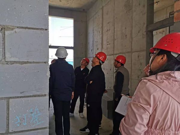 陜煤建設天工公司銅川項目部承建的富秦鑫苑5#樓 順利通過主體分部驗收